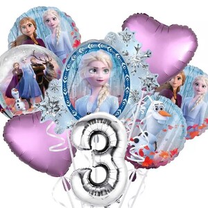 May include: A set of Frozen-themed balloons featuring characters such as Elsa, Anna, Olaf, and Kristoff. The balloons are in various shapes, including hearts, circles, and a number 3 balloon. The balloons are silver, purple, and blue.