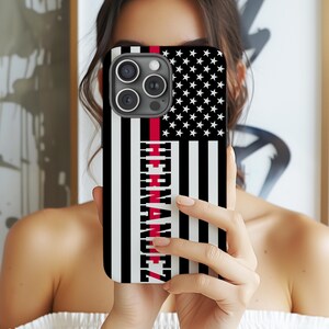 May include: Black and white American flag phone case with a red stripe and the name "HERNANDEZ" printed vertically on the left side.