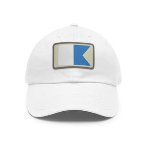 May include: White baseball cap with a blue and white nautical flag patch.