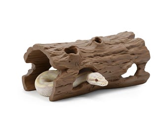 May include: A brown, textured, artificial log with openings, designed as a reptile hideaway. A light-colored snake is partially visible inside the log, with its head peeking out. The log has a naturalistic appearance, suitable for a pet's habitat.