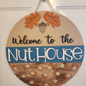 Nuthouse Welcome Door Hanger: Fall Decor, Round Wood Sign