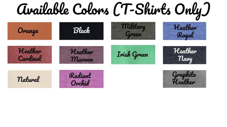 May include: A color chart showing the available colors for t-shirts. The colors include orange, black, military green, heather royal, heather cardinal, heather maroon, Irish green, heather navy, natural, radiant orchid, and graphite heather.