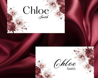 May include: Two white cards with a floral design in shades of burgundy and cream. The text "Chloe Smith" is printed on each card.