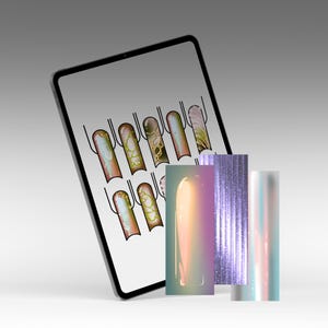 May include: A digital tablet displays nail art designs, showcasing various styles with gold accents and intricate patterns. Accompanying the tablet are several rectangular cards featuring iridescent and glittery textures, perfect for nail art inspiration.