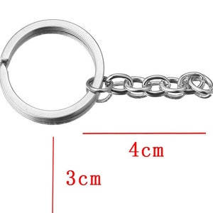 May include: Silver key chain with a 3 inch diameter ring and a 4 inch chain.