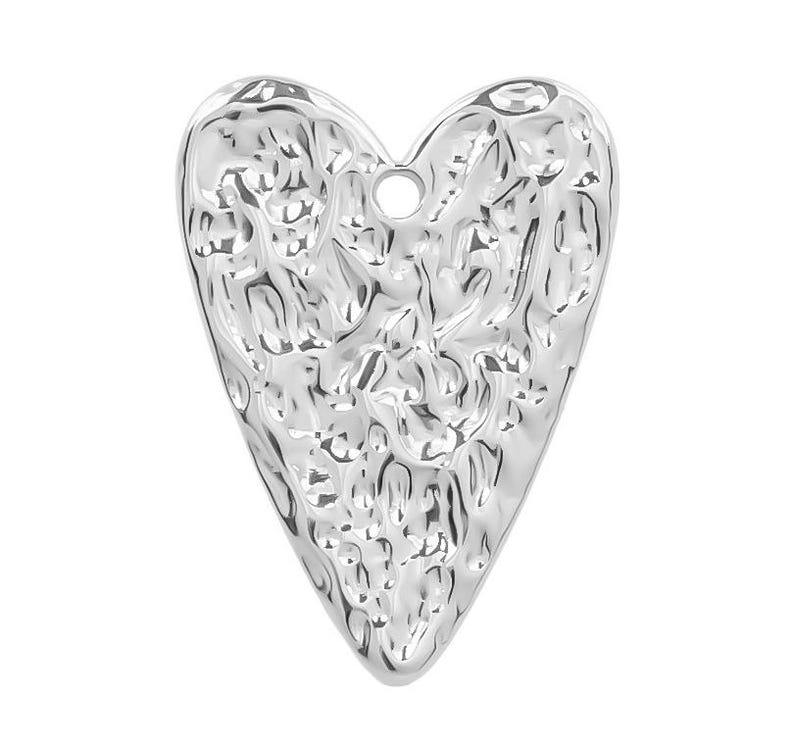 May include: A silver heart-shaped charm with a textured surface. The charm has a small hole at the top for attaching to a necklace or bracelet.