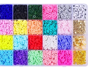May include: A clear plastic storage box filled with colorful round beads, letter beads, and gold-colored charms. The beads are arranged in rows and columns, with each compartment containing a different color.