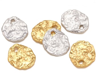 May include: Six metal charms with an irregular, textured surface. Three charms are gold and three are silver. Each charm has a small hole for attaching to a chain or bracelet.