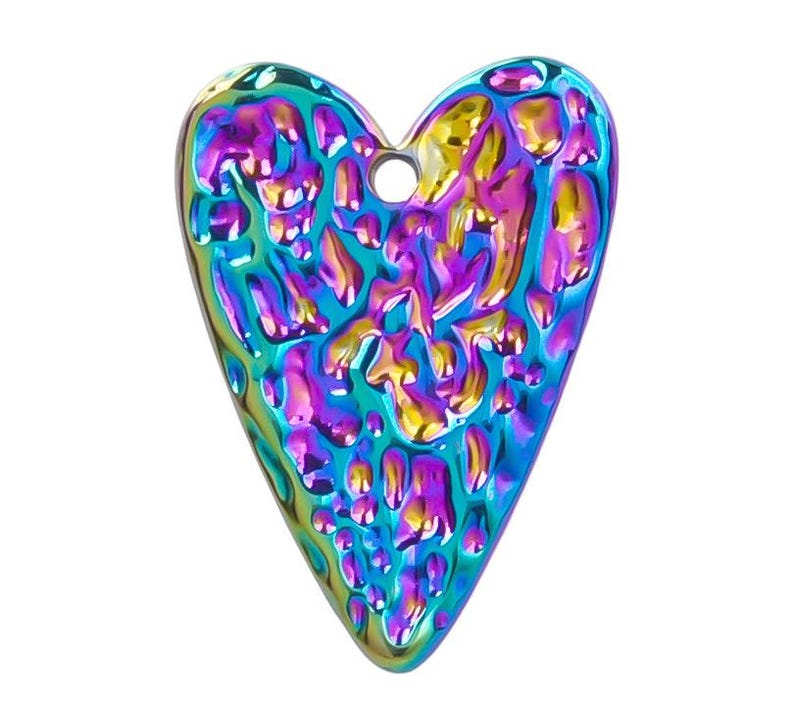 May include: A heart-shaped charm with a textured surface and iridescent finish. The charm is a vibrant mix of blue, purple, green, and yellow.