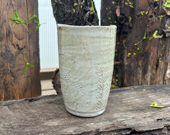 White ceramic flower travel tumbler