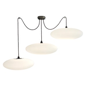 May include: A modern three-light pendant lamp with a white, oval-shaped shade. The lamp has a black cord and a dark metal ceiling mount. The shades are evenly spaced and create a soft, diffused light.