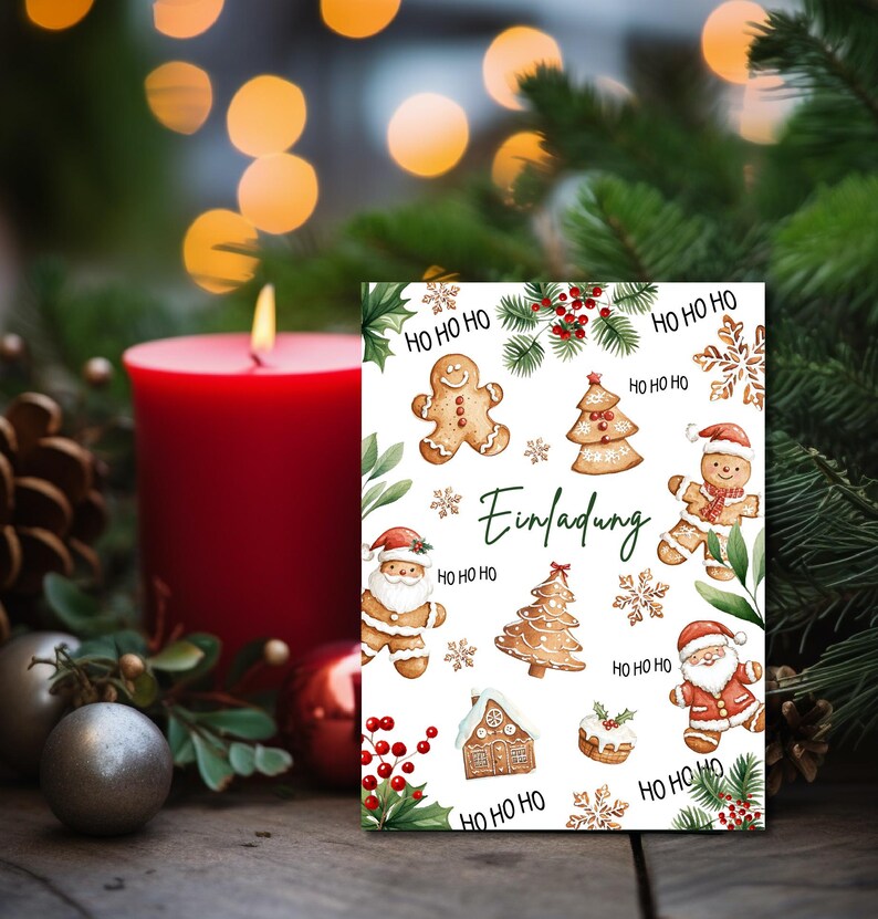 May include: A white card with a Christmas invitation design. The card features gingerbread men, Christmas trees, snowflakes, and the text "Einladung" which means "Invitation" in German. The card is surrounded by greenery and a red candle.