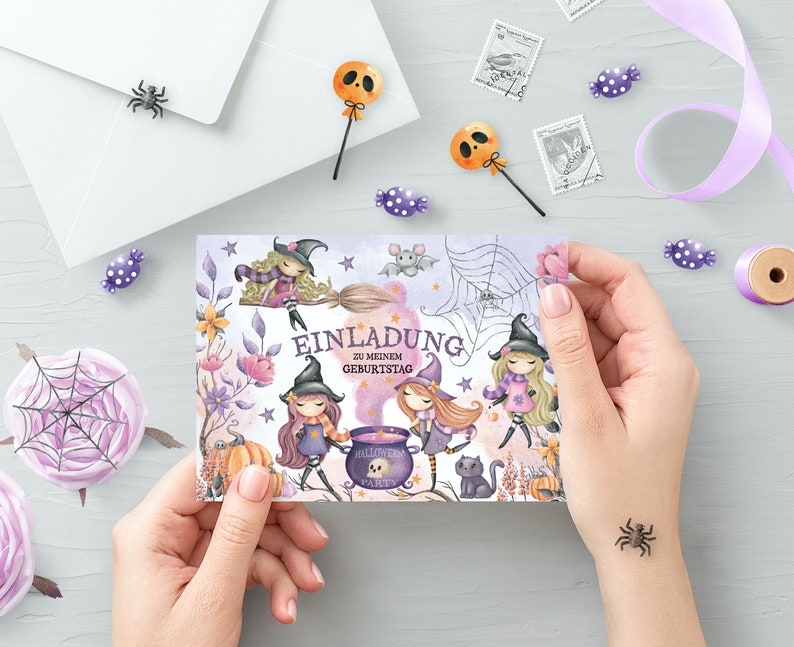 May include: A purple and white invitation card with a Halloween theme. The card features three witches with broomsticks, a cauldron, and the text "Einladung zu meinem Geburtstag".