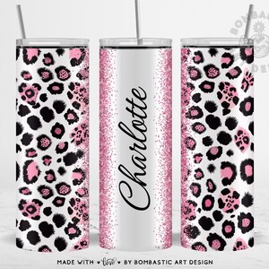 May include: Three stainless steel tumblers with lids and straws. The tumblers feature a white background with a pink and black leopard print design. The center tumbler has the name "Charlotte" in black script with a pink glitter border.