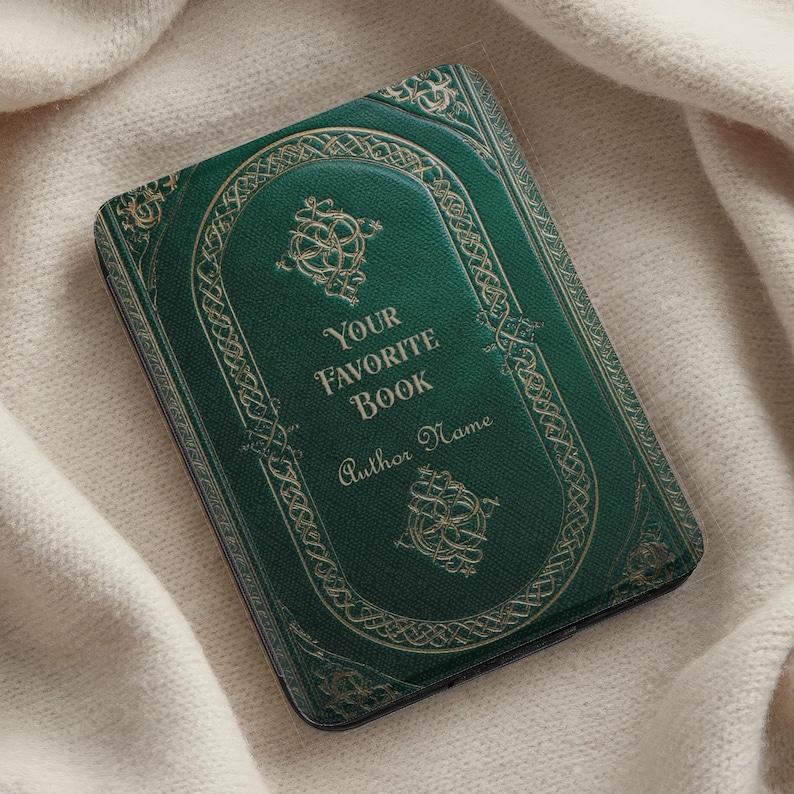 May include: A green book cover with gold accents and the text "YOUR FAVORITE BOOK" and "Author Name". The cover has an ornate design with a textured appearance, resembling an antique book. The background is a soft, off-white fabric.