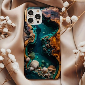 May include: A phone case with a vibrant, artistic design featuring a deep teal river scene with seashells, coral, and a mix of brown and gold tones. The case has a glossy finish and a multi-camera lens cutout.