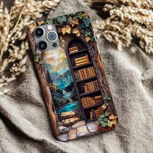 May include: A phone case with a detailed illustration of a bookshelf inside an arched doorway. The design includes a landscape with a waterfall, a river, and a mountain range. The case is adorned with leaves and vines.
