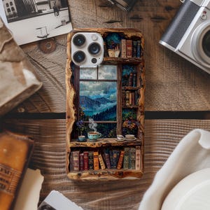 May include: A wooden phone case with a detailed bookshelf design and a window overlooking a mountain landscape. The case features a shelf with books, a teacup, and a view of a rainy day. The case is designed for a phone with multiple camera lenses.