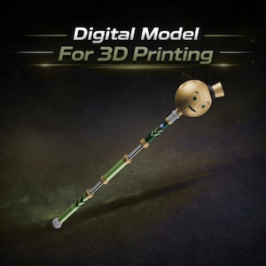 May include: A digital model for 3D printing of a whimsical staff. The staff features a round, tan head with a smiling face and a small black hat. The shaft is green and silver with decorative gold accents. The text "Digital Model For 3D Printing" is at the top.