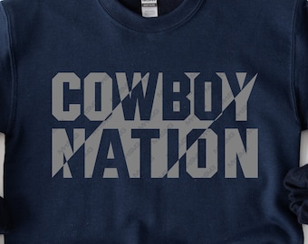 May include: A navy blue sweatshirt with the text "COWBOY NATION" in a gray, diagonal, striped pattern.