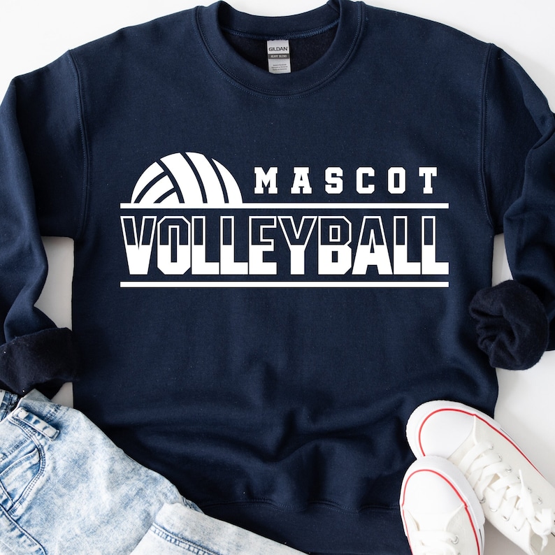 May include: A navy blue sweatshirt with white text that reads "Mascot Volleyball" and a white volleyball graphic.