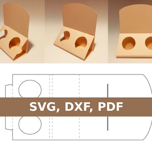 Könnte beinhalten: Eine druckbare Vorlage für einen Karton-Präsentationsständer mit zwei runden Ausschnitten. Die Vorlage ist mit "SVG, DXF, PDF" beschriftet.