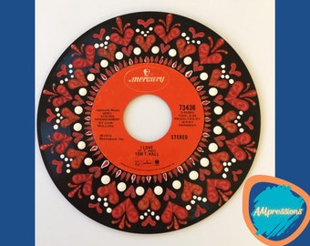 May include: A black vinyl record with a red and white heart design. The record label is orange and features the text "Mercury", "I Love To My Hall", "Tom T. Hall", "73436", "2-50283", "Time: 2:06", "Produced By Jerry Kennedy", and "Stereo".