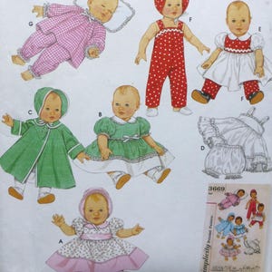 May include: Simplicity Baby Doll sewing pattern. The pattern features doll clothes in three sizes. The cover shows illustrations of baby dolls wearing various outfits, including dresses, rompers, and coats. The pattern is designed by Teri.