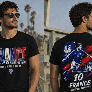 May include: Black t-shirt with "FRANCE" in red, white, and blue, featuring the Eiffel Tower and Arc de Triomphe. The back displays a soccer player in a blue uniform with the number 10, a soccer ball, and the text "FRANCE".