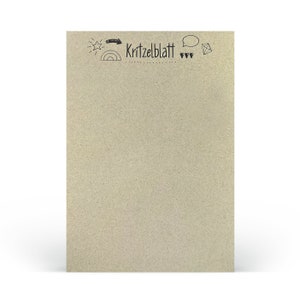Könnte beinhalten: Ein leerer, brauner Papierblock mit dem Text "Kritzelblatt" oben. Der Block ist mit einem Stern, einem Regenbogen, einer Sprechblase, einem Diamanten und ein paar Herzen verziert.