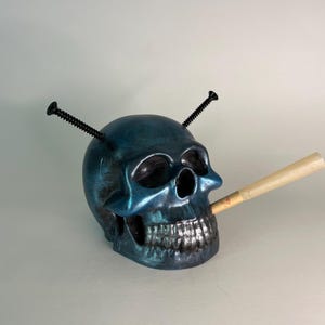 Hand painted, poured and crafted skull. Collectible art piece  one of a kind. This dude is Hard.