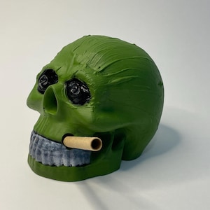 Hand painted, poured and crafted skull. Collectible art piece .