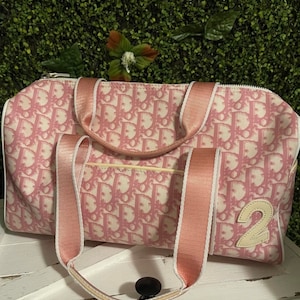 Christian Dior 2000s Pink Monogram Pouch Handbag · INTO