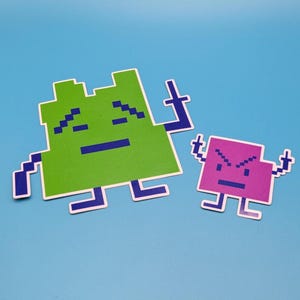 May include: Two pixelated character stickers on a blue background. One is green with blue accents, the other is purple with blue accents. The characters have blocky features and are in a retro video game style.