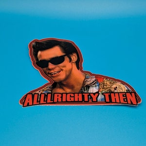 May include: A red and white sticker with a photo of a man wearing sunglasses and a Hawaiian shirt. The text "ALL RIGHTY THEN" is printed in red on the sticker.
