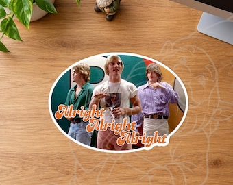 May include: An oval sticker featuring a scene from the film Dazed and Confused with three people standing in front of a green and white background. The text Alright Alright Alright is written in a retro orange font across the center.
