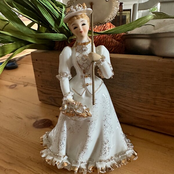 Lady holding umbrella figurine by Lefton