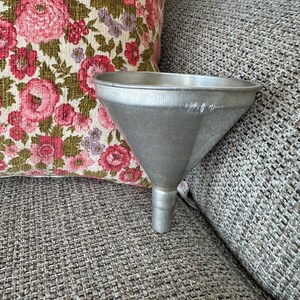 May include: A rustic wooden sign with the text "Welcome to our home" in white lettering. The sign features a distressed finish and a simple, inviting design, perfect for front door decor.