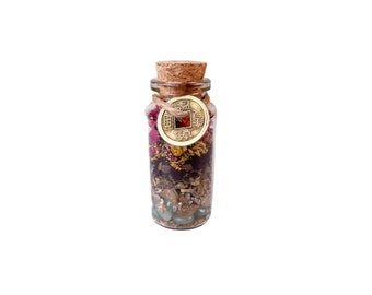 May include: A glass bottle filled with dried herbs, flowers, and crystals, topped with a cork stopper and a gold coin charm with Chinese characters.