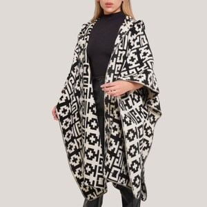 Elevate your style with our Closed Oversized Unisex Poncho. Fashion meets comfort in this lightweight, hypoallergenic design, perfect for all seasons. Ethically crafted with vegan materials
