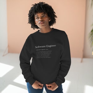 May include: A black sweatshirt with the text "Software Engineer" and a definition of the term in white text.