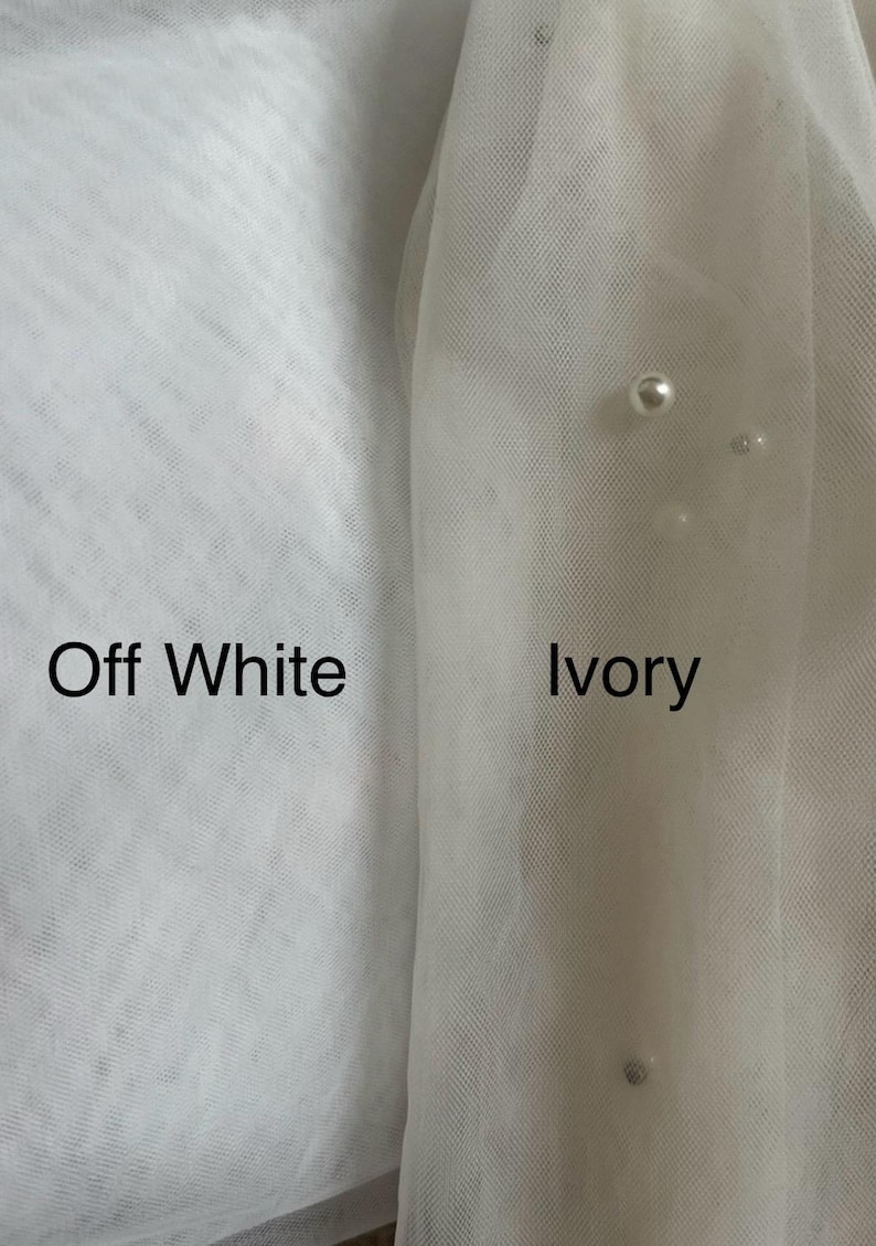 May include: Close-up of two swatches of fabric, one labeled "Off White" and the other labeled "Ivory". The ivory swatch has a slightly more yellow hue than the off-white swatch.