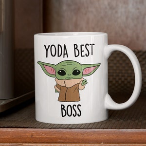 May include: White ceramic mug with a green cartoon character and the text "Yoda Best Boss".