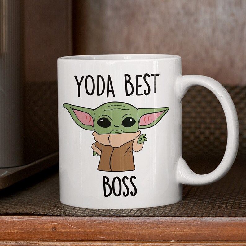 May include: White ceramic mug with a green cartoon character and the text "Yoda Best Boss".