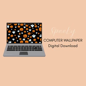 May include: A gray laptop displays a Halloween-themed computer wallpaper. The wallpaper features orange jack-o'-lanterns and white ghosts on a black background. The text "Spooky COMPUTER WALLPAPER Digital Download" is displayed on the right side of the laptop.
