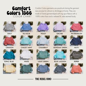 May include: Color chart of Comfort Colors 1566 garments. The chart displays various sweatshirt colors, including gray, blue, violet, orchid, and watermelon. The text describes the fabric as pre-shrunk, garment-dyed, soft ring spun fleece with a 100% cotton face.
