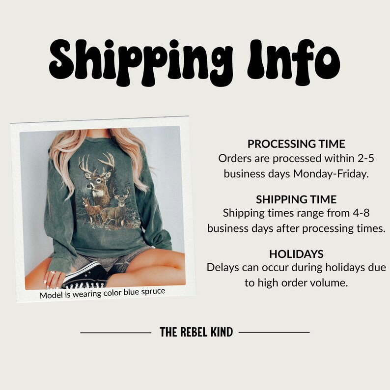May include: A blue spruce-colored sweatshirt featuring a detailed graphic of deer. The sweatshirt is part of a clothing collection. The text "THE REBEL KIND" is at the bottom of the image.