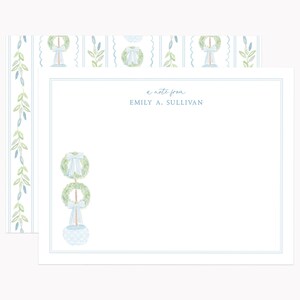 May include: A white note card with a blue border and a blue and green wreath design. The text "a note from Emily A. Sullivan" is printed on the card.