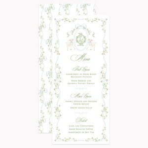 May include: A vertical menu card featuring a white background with a light blue ribbon and green vine border. The top displays a decorative oval frame with two lambs and a central monogram. The text includes Menu, First Course, Main Course, and Dessert.
