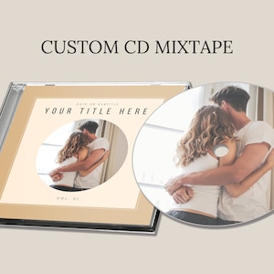 May include: A custom CD mixtape with a beige background and a circular image of a couple embracing in front of a window. The text "YOUR TITLE HERE" is printed in black on the CD case. The text "DATE OR SUBTITLE" is printed in black above the title. The text "VOL. 01" is printed in black below the image.